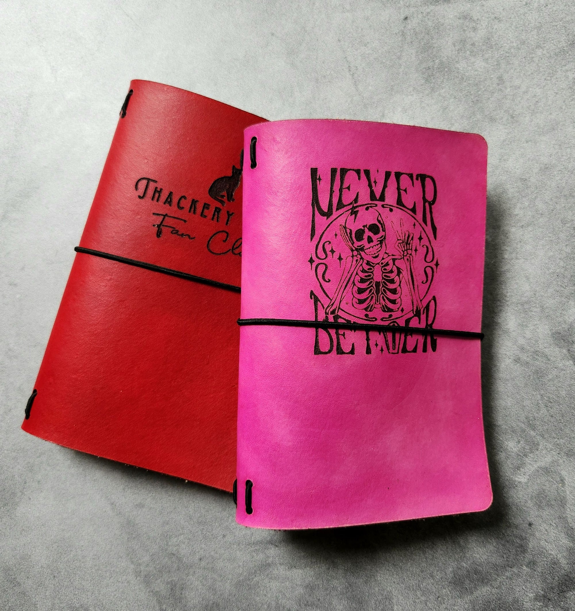 pocket sized leather journals, red and pink, various engraved designs